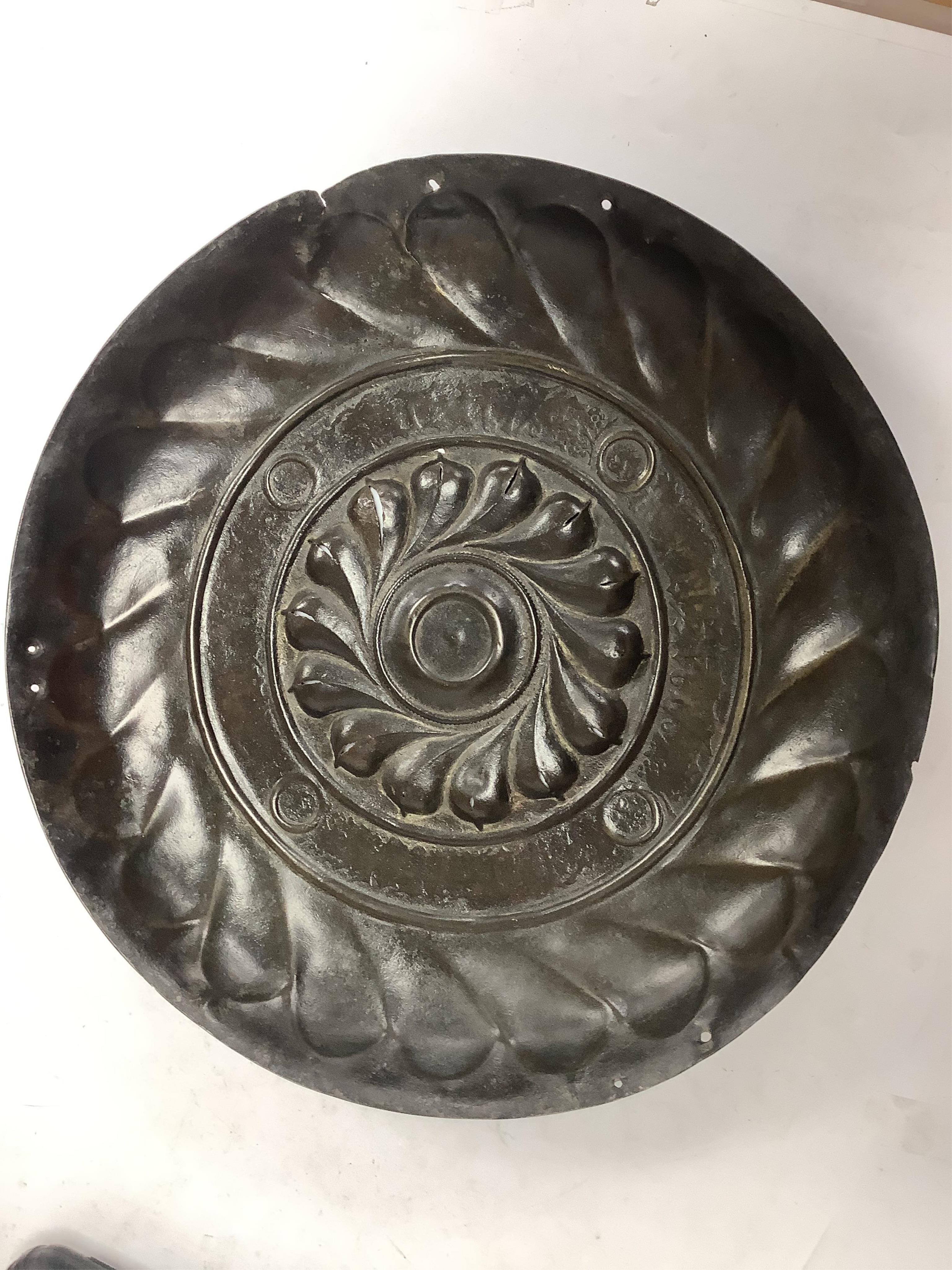 A 17th century Nuremburg embossed brass alms dish, and other metalware, dish 34cm. Condition - worn